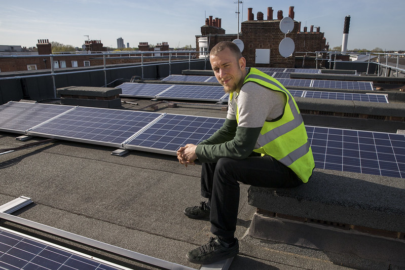 Trainee at Elmore House solar installation. Photo courtesy of Ashden